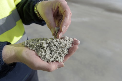 A person holds processed lithium.